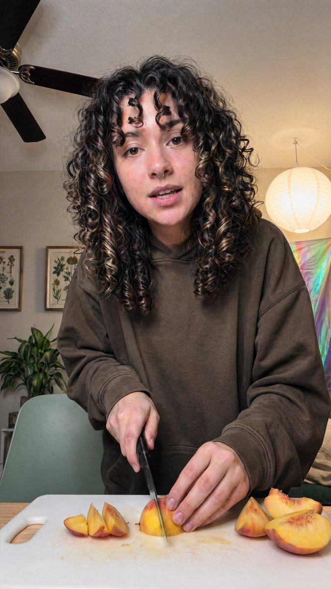 Cozy Indoor Peach Slicing Portrait example image